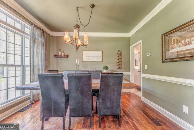 119 Creekside Vw, Hiram, GA 30141 - dining space with a chandelier, ornamental molding, and dark wood-type flooring