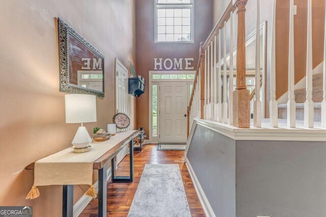 119 Creekside Vw, Hiram, GA 30141 - foyer featuring wood finished floors, plenty of natural light, stairway, and a high ceiling