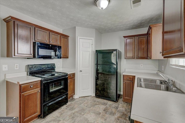 2898 Cedar Trace Dr, Ellenwood, GA 30294 - kitchen featuring black appliances, light countertops, and a textured ceiling