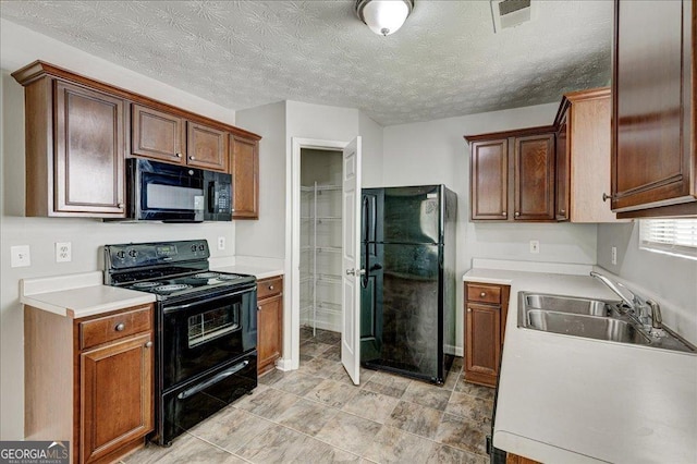 2898 Cedar Trace Dr, Ellenwood, GA 30294 - kitchen with black appliances, light countertops, and light tile patterned flooring
