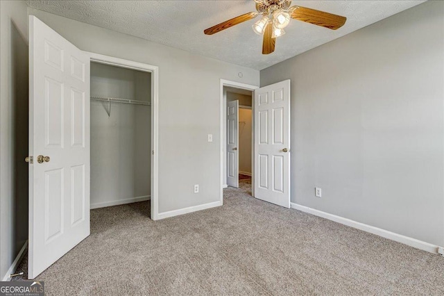 2898 Cedar Trace Dr, Ellenwood, GA 30294 - unfurnished bedroom with carpet, a closet, and ceiling fan
