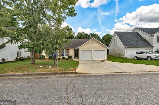 2898 Cedar Trace Dr, Ellenwood, GA 30294 - view of front of home featuring concrete driveway, an attached garage, and a front lawn