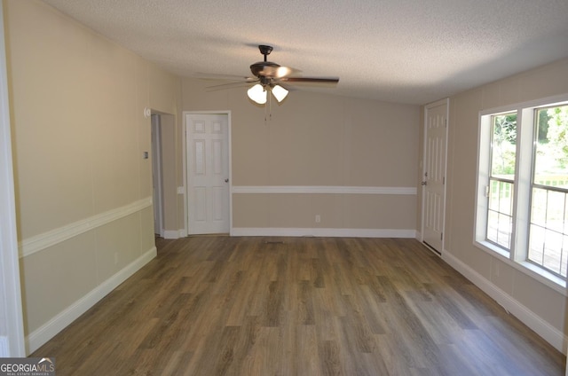 325 High Rd, Forsyth, GA 31029 - empty room featuring a textured ceiling, wood finished floors, ceiling fan, and plenty of natural light
