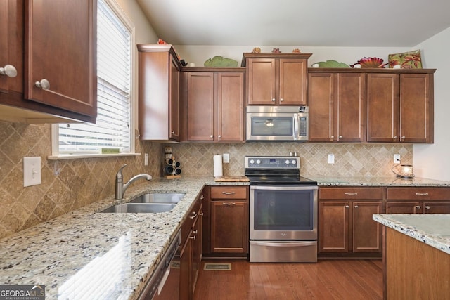 218 Ballymore Ln, Acworth, GA 30102 - kitchen with appliances with stainless steel finishes, dark wood-style floors, plenty of natural light, and light stone countertops