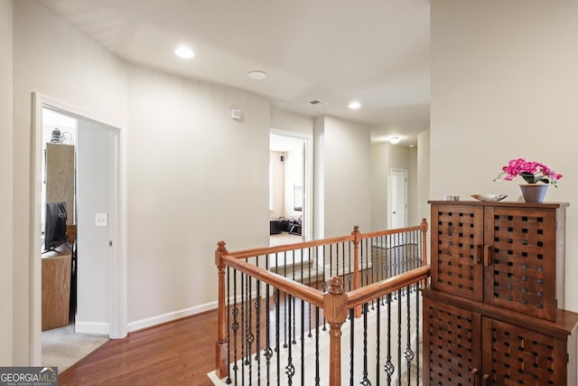 218 Ballymore Ln, Acworth, GA 30102 - hallway with an upstairs landing, recessed lighting, and wood finished floors