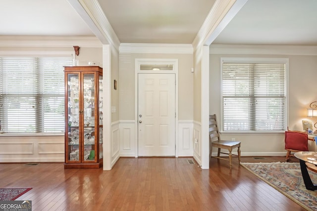 218 Ballymore Ln, Acworth, GA 30102 - foyer entrance featuring hardwood / wood-style floors, ornamental molding, a wainscoted wall, and a decorative wall