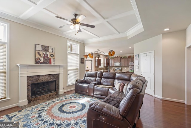 218 Ballymore Ln, Acworth, GA 30102 - living area with coffered ceiling, ceiling fan, ornamental molding, a premium fireplace, and dark wood-style flooring