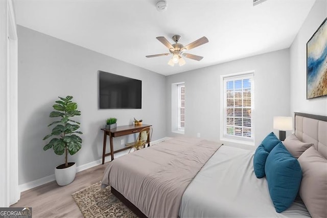 3091 Colonial Way Unit E4, Chamblee, GA 30341 - bedroom featuring light wood-type flooring and ceiling fan