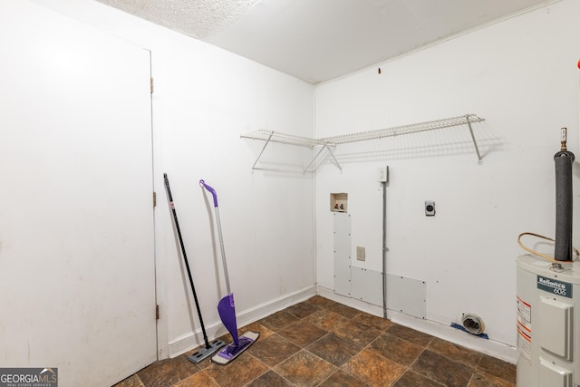 712 Moore Ave, Lafayette, GA 30728 - laundry area featuring water heater, electric dryer hookup, hookup for a washing machine, and stone finish floors