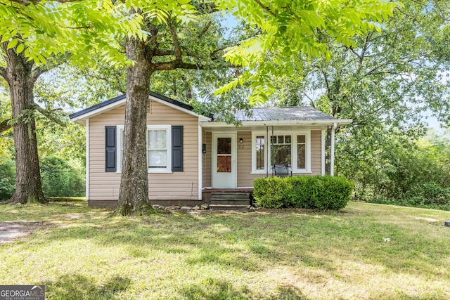 712 Moore Ave, Lafayette, GA 30728 - view of front of home with a front yard and a metal roof