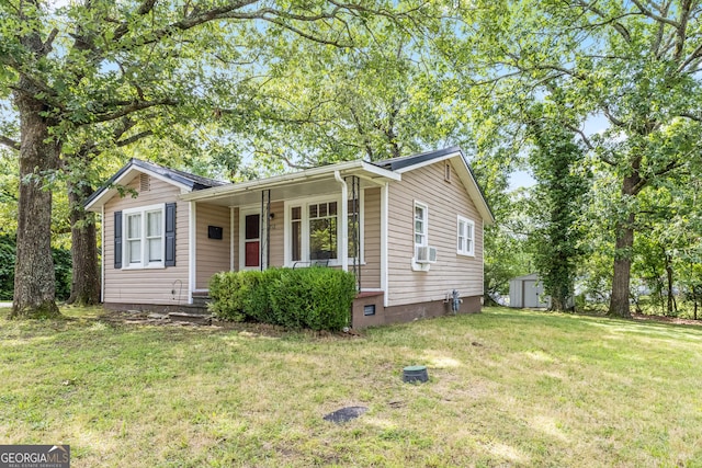 712 Moore Ave, Lafayette, GA 30728 - single story home with a storage unit, a front yard, and a porch