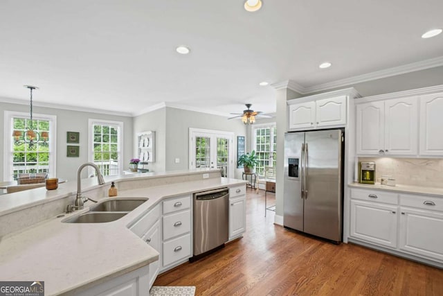 7615 Laurel Oak Dr, Suwanee, GA 30024 - kitchen with stainless steel appliances, crown molding, recessed lighting, ceiling fan, and white cabinets