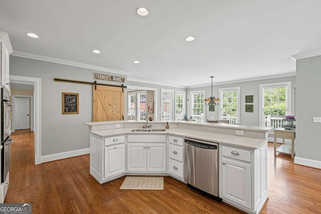 7615 Laurel Oak Dr, Suwanee, GA 30024 - kitchen with dishwasher, crown molding, a barn door, light countertops, and white cabinets