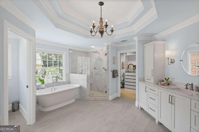 7615 Laurel Oak Dr, Suwanee, GA 30024 - bathroom featuring a marble finish shower, a chandelier, a freestanding tub, vanity, and ornamental molding