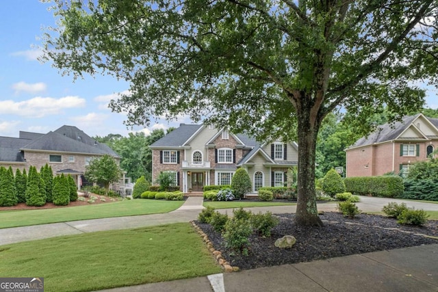 7615 Laurel Oak Dr, Suwanee, GA 30024 - traditional-style home with a front yard