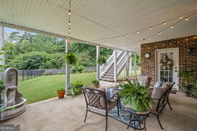 7615 Laurel Oak Dr, Suwanee, GA 30024 - fenced backyard featuring a patio, stairway, and outdoor lounge area