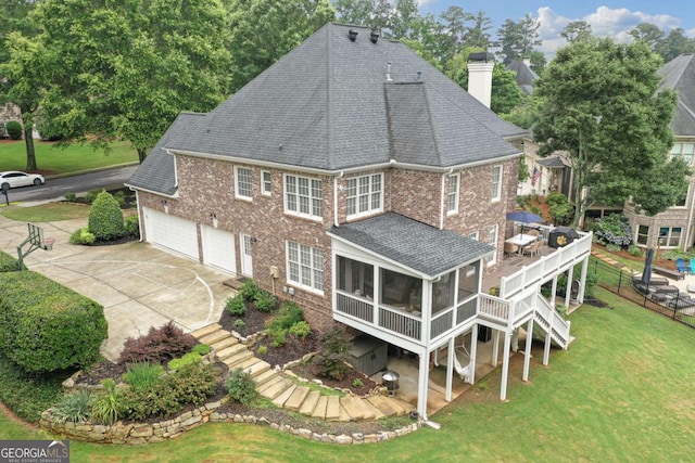 7615 Laurel Oak Dr, Suwanee, GA 30024 - back of property with stairway, a chimney, roof with shingles, concrete driveway, and a wooden deck