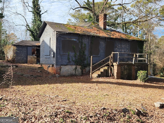 366 Seventh Ave, Scottdale, GA 30079 - view of side of home with a chimney, crawl space, and stairway