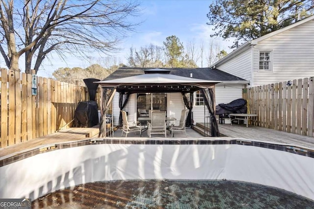 916 Marshall Fuller Rd, Dallas, GA 30157 - view of swimming pool featuring a gazebo, a wooden deck, grilling area, and a fenced backyard