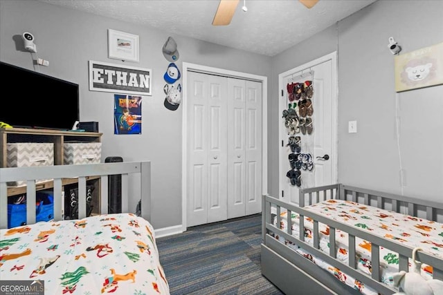 916 Marshall Fuller Rd, Dallas, GA 30157 - carpeted bedroom with a closet, a textured ceiling, and ceiling fan