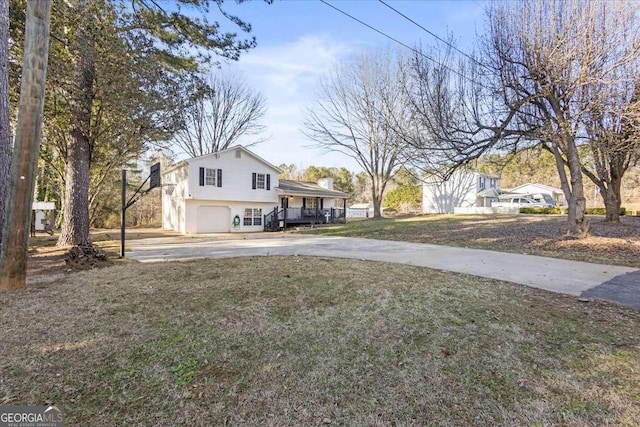 916 Marshall Fuller Rd, Dallas, GA 30157 - tri-level home featuring driveway, a garage, a chimney, a front lawn, and a porch