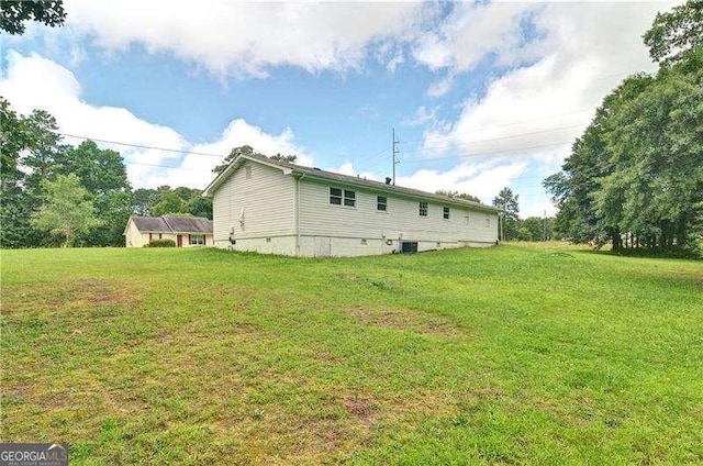 24 Echo Ridge Dr, Powder Springs, GA 30127 - back of house with a lawn