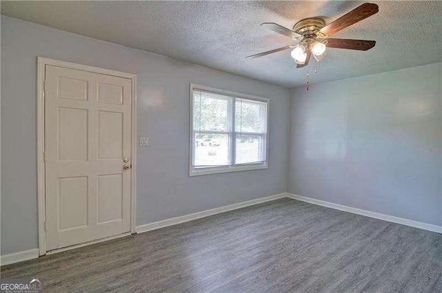 24 Echo Ridge Dr, Powder Springs, GA 30127 - unfurnished room featuring wood finished floors, a ceiling fan, and a textured ceiling