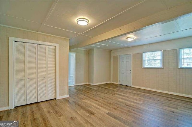 24 Echo Ridge Dr, Powder Springs, GA 30127 - unfurnished living room with wood finished floors and baseboards