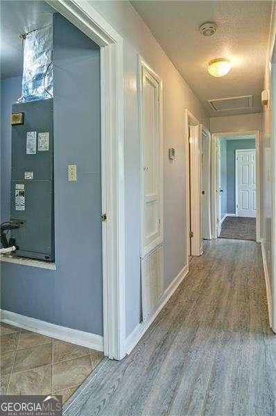 24 Echo Ridge Dr, Powder Springs, GA 30127 - hallway with wood finished floors and attic access