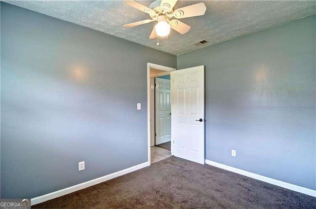 24 Echo Ridge Dr, Powder Springs, GA 30127 - empty room featuring a textured ceiling, carpet floors, and a ceiling fan