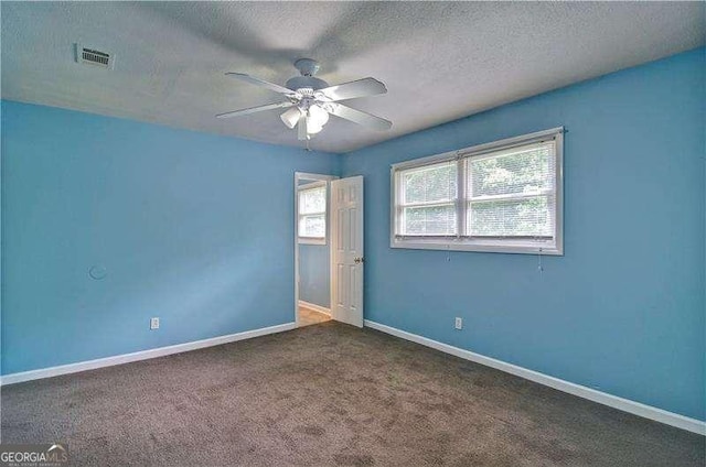 24 Echo Ridge Dr, Powder Springs, GA 30127 - spare room featuring a ceiling fan, carpet, and a textured ceiling