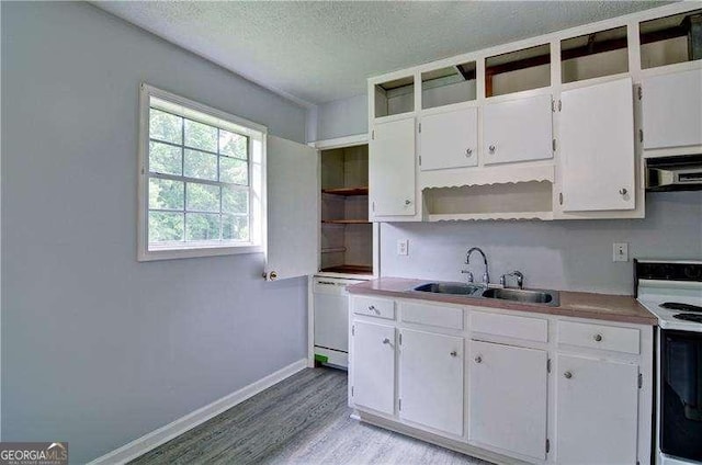24 Echo Ridge Dr, Powder Springs, GA 30127 - kitchen with open shelves, white appliances, light wood-style floors, exhaust hood, and white cabinetry