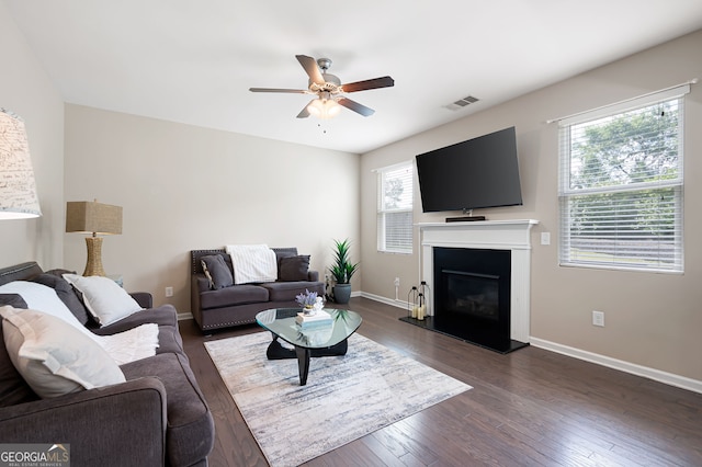 207 Cross Rd, Acworth, GA 30102 - living area featuring ceiling fan, dark wood-style flooring, and a glass covered fireplace