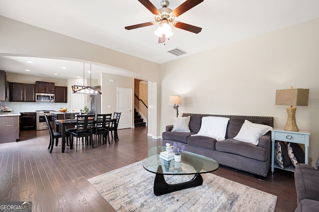 207 Cross Rd, Acworth, GA 30102 - living room featuring ceiling fan, dark wood-type flooring, stairs, arched walkways, and recessed lighting