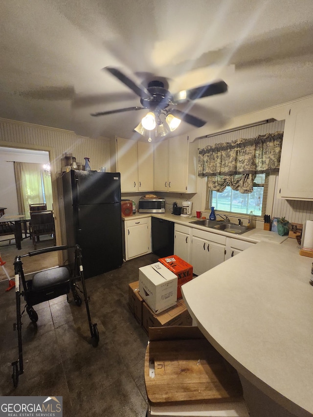 5001 Old Dawson Rd, Albany, GA 31721 - kitchen with black appliances, white cabinets, ceiling fan, and light countertops