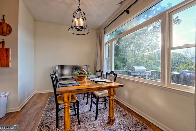 63 Maple Ridge Trl, Clayton, GA 30525 - dining area with wood finished floors and a chandelier
