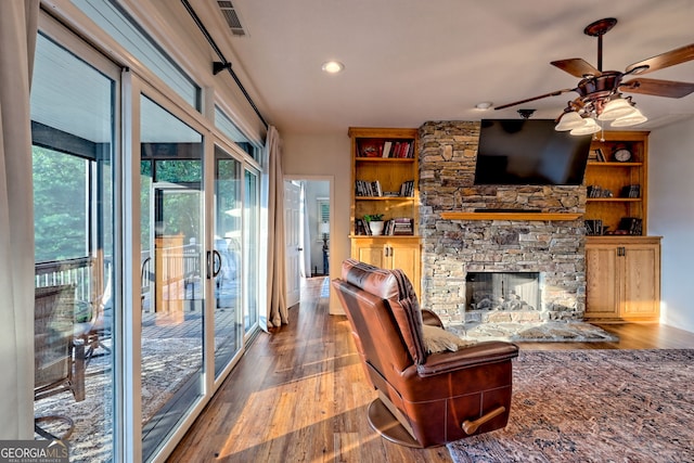 63 Maple Ridge Trl, Clayton, GA 30525 - living room with ceiling fan, wood finished floors, a fireplace, recessed lighting, and built in shelves