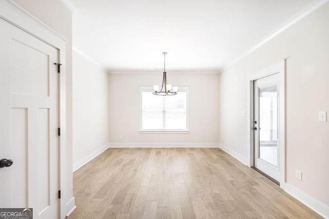 115 Gracetree Way, Kathleen, GA 31047 - unfurnished dining area featuring a chandelier, crown molding, and light wood finished floors