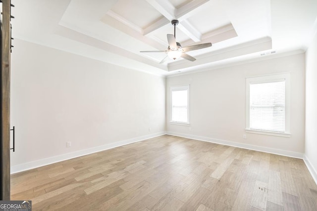115 Gracetree Way, Kathleen, GA 31047 - unfurnished room featuring a tray ceiling, light wood-style flooring, ceiling fan, coffered ceiling, and crown molding