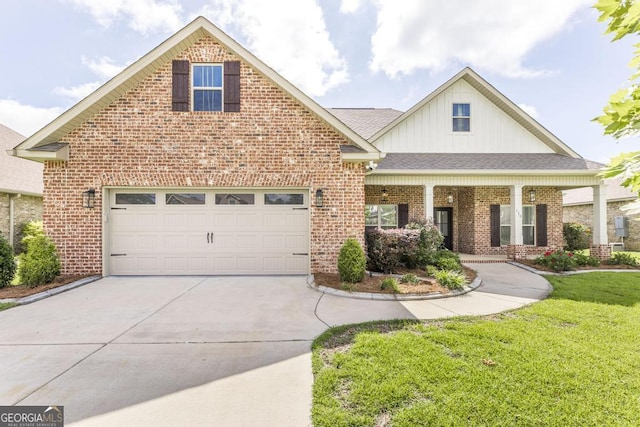 115 Gracetree Way, Kathleen, GA 31047 - view of front of home featuring brick siding, driveway, board and batten siding, a front lawn, and a garage