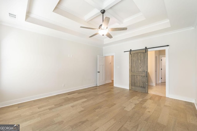 115 Gracetree Way, Kathleen, GA 31047 - spare room featuring a barn door, coffered ceiling, a ceiling fan, light wood-style flooring, and ornamental molding