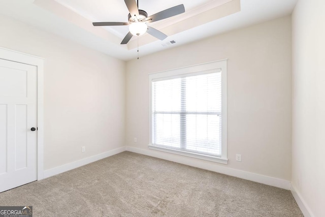 115 Gracetree Way, Kathleen, GA 31047 - carpeted spare room featuring a ceiling fan and a tray ceiling