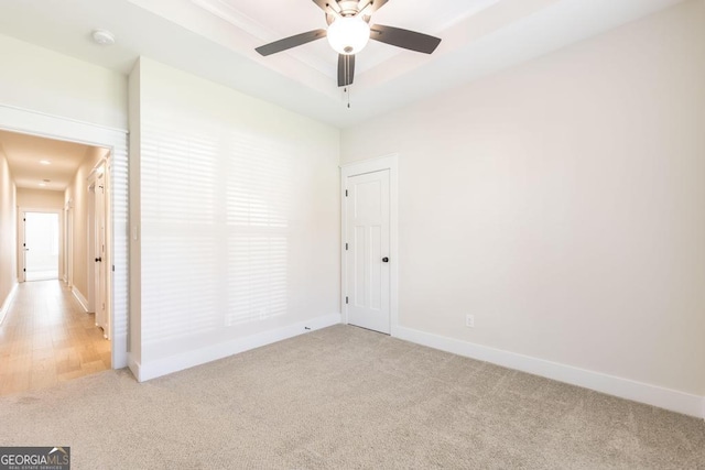 115 Gracetree Way, Kathleen, GA 31047 - unfurnished room with light carpet, a ceiling fan, a tray ceiling, and a smoke detector