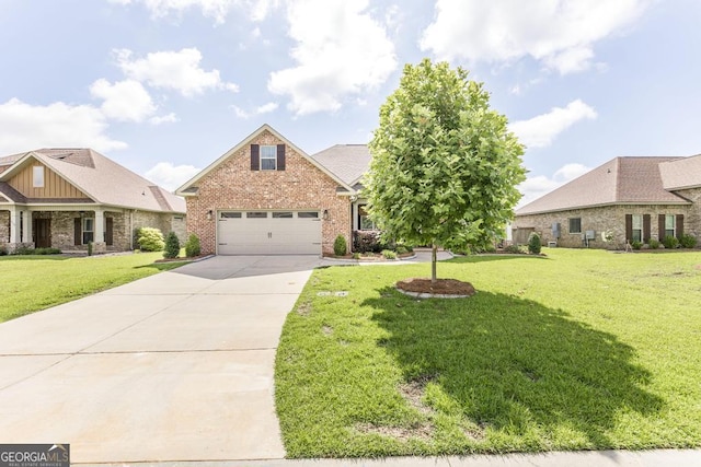 115 Gracetree Way, Kathleen, GA 31047 - view of front of house with brick siding, driveway, a front lawn, and an attached garage
