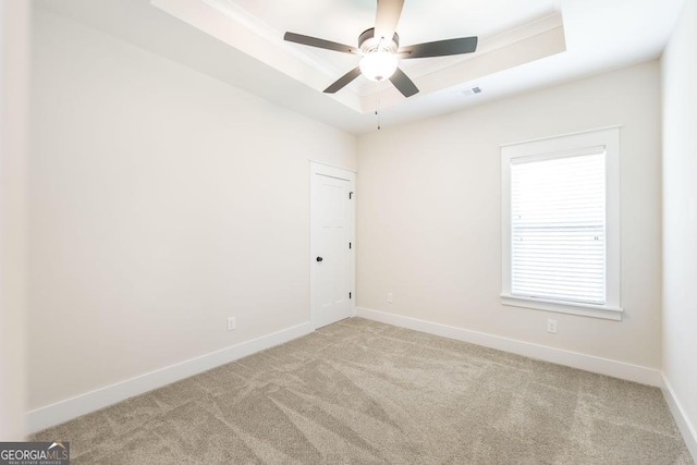 115 Gracetree Way, Kathleen, GA 31047 - empty room featuring a tray ceiling, ceiling fan, and carpet floors