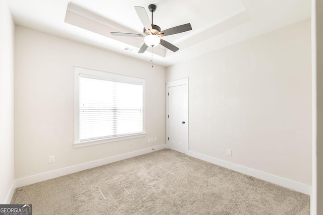 115 Gracetree Way, Kathleen, GA 31047 - unfurnished room featuring carpet flooring, a raised ceiling, and a ceiling fan