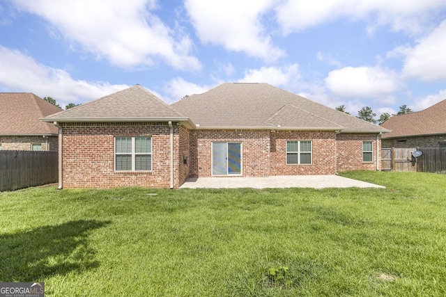 115 Gracetree Way, Kathleen, GA 31047 - rear view of house featuring a patio area, a fenced backyard, roof with shingles, and brick siding