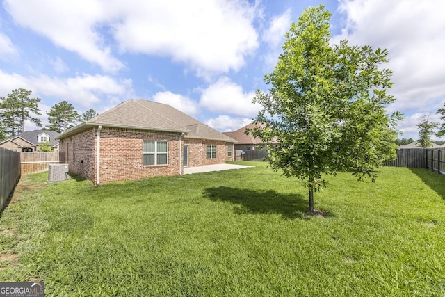 115 Gracetree Way, Kathleen, GA 31047 - back of property with brick siding, a fenced backyard, a shingled roof, and a patio
