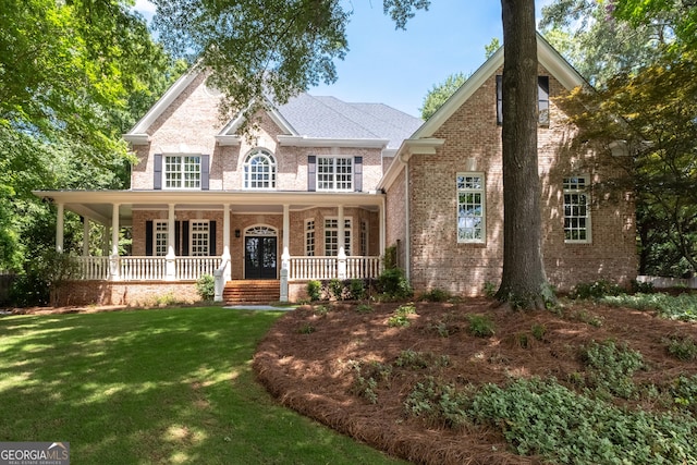 1650 Harvest Ln, Alpharetta, GA 30004 - view of front facade with brick siding, covered porch, and a front yard
