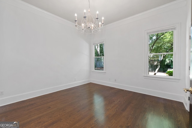 1650 Harvest Ln, Alpharetta, GA 30004 - spare room with a chandelier, healthy amount of natural light, dark wood-style floors, and crown molding